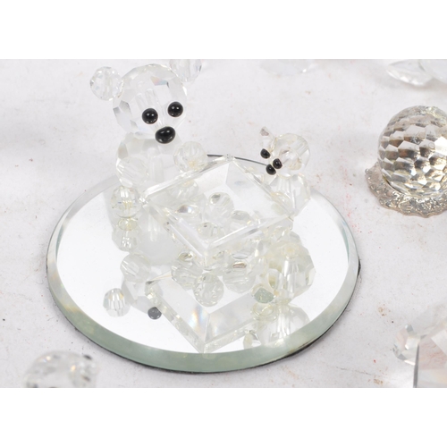 104 - Swarovski Crystal - A collection of glass crystal figures / ornaments. Comprising of mice, frogs, do... 