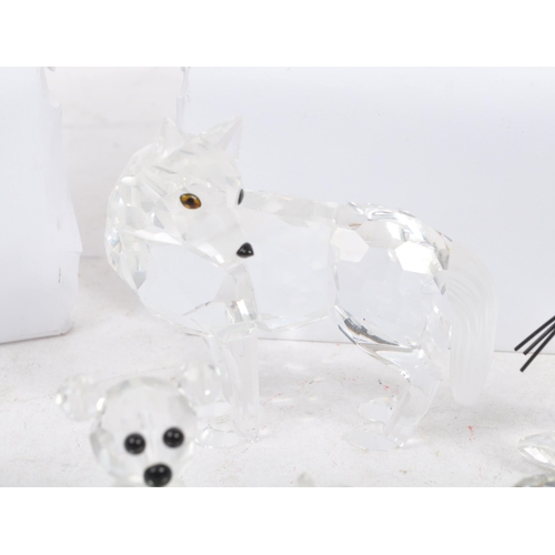 104 - Swarovski Crystal - A collection of glass crystal figures / ornaments. Comprising of mice, frogs, do... 