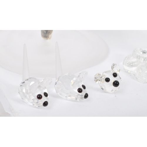 104 - Swarovski Crystal - A collection of glass crystal figures / ornaments. Comprising of mice, frogs, do... 