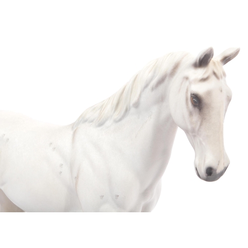 107 - Royal Doulton - A vintage 20th century porcelain china statue of a horse. Titled desert orchid. In a... 