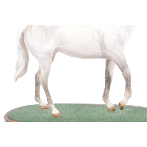 107 - Royal Doulton - A vintage 20th century porcelain china statue of a horse. Titled desert orchid. In a... 