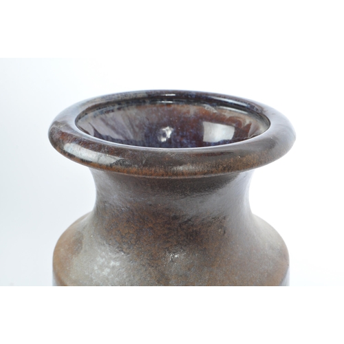 108 - A mid 20th century West German pottery vase. The vase having glaze in shades of brown, grey, and ora... 