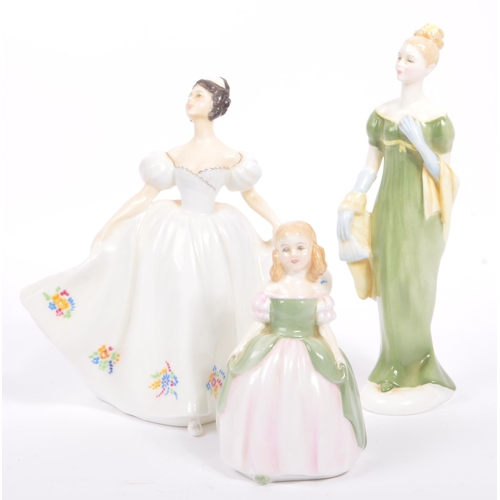 12 - Royal Doulton - A collection of eight mid 20th century porcelain table ware female figurines. Includ... 