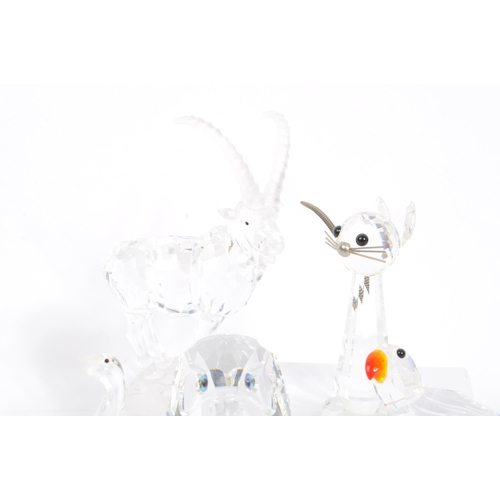 127 - Swarovski - A large collection of Swarovski crystal figures. The collection to include examples of p... 