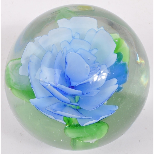 130 - A large collection of mid 20th century glass paperweights. The collection to include canework, lamp ... 