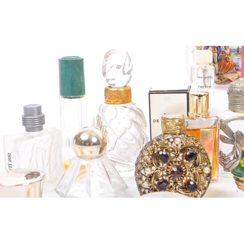 131 - A large collection of perfume and fragrance miniatures and samples. The lot to include examples such... 