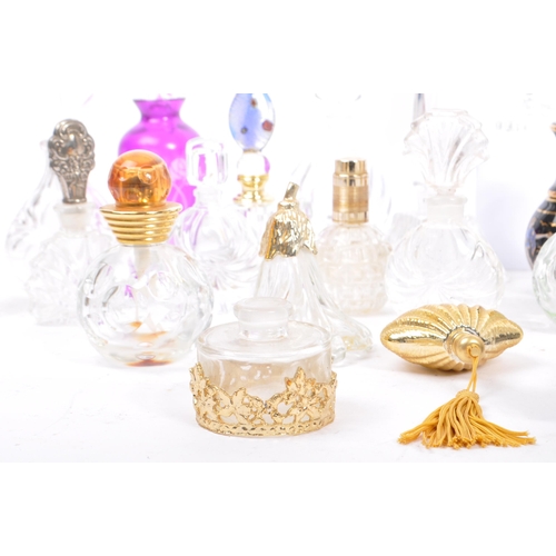 133 - A large collection of vintage perfume and fragrance bottles, with some cut glass examples. The lot t... 