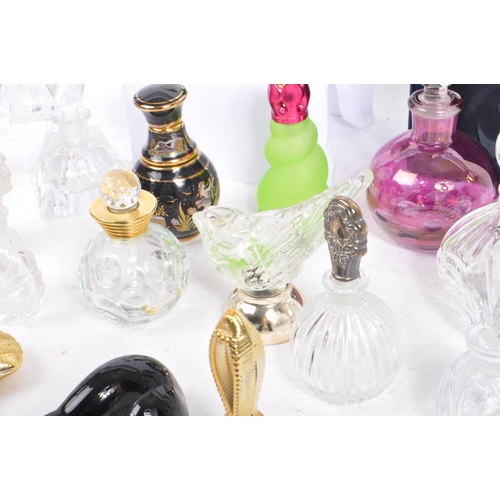 133 - A large collection of vintage perfume and fragrance bottles, with some cut glass examples. The lot t... 