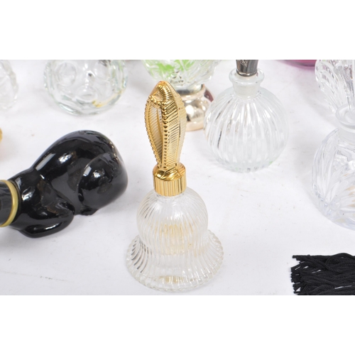 133 - A large collection of vintage perfume and fragrance bottles, with some cut glass examples. The lot t... 