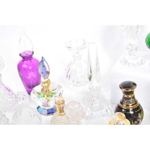 133 - A large collection of vintage perfume and fragrance bottles, with some cut glass examples. The lot t... 