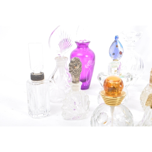 133 - A large collection of vintage perfume and fragrance bottles, with some cut glass examples. The lot t... 