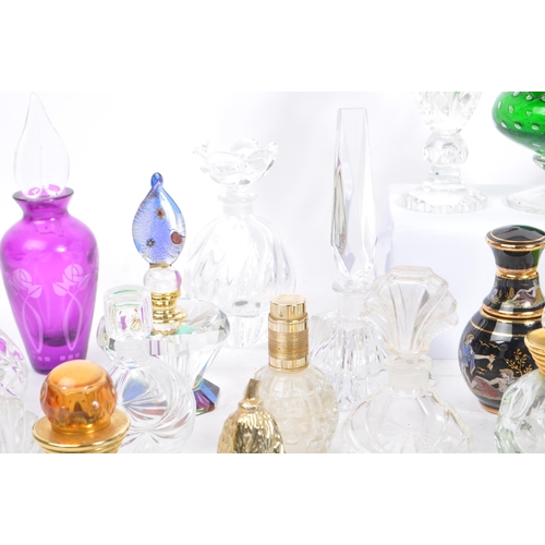 133 - A large collection of vintage perfume and fragrance bottles, with some cut glass examples. The lot t... 