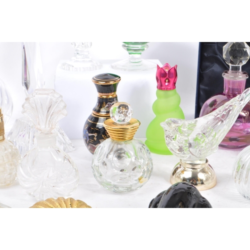 133 - A large collection of vintage perfume and fragrance bottles, with some cut glass examples. The lot t... 