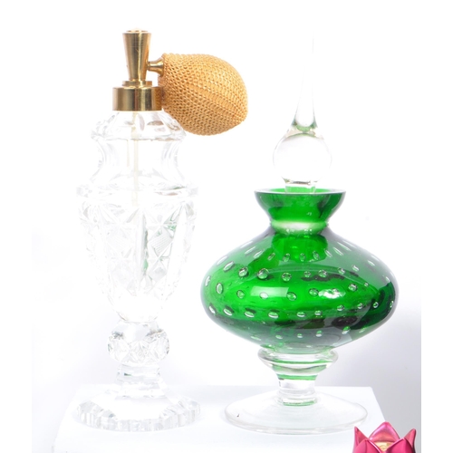 133 - A large collection of vintage perfume and fragrance bottles, with some cut glass examples. The lot t... 