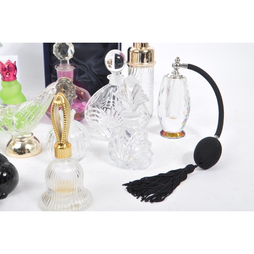 133 - A large collection of vintage perfume and fragrance bottles, with some cut glass examples. The lot t... 