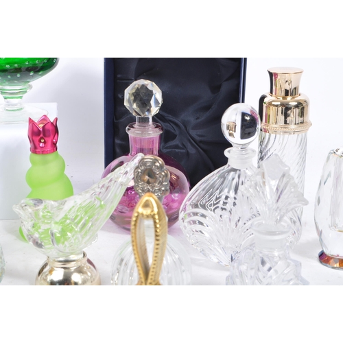 133 - A large collection of vintage perfume and fragrance bottles, with some cut glass examples. The lot t... 