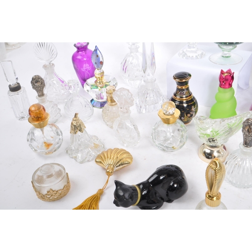 133 - A large collection of vintage perfume and fragrance bottles, with some cut glass examples. The lot t... 