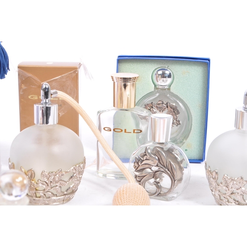 134 - A large collection of vintage perfume and fragrance bottles, with some cut glass examples. The major... 