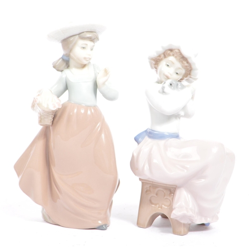 139 - A collection of five vintage ceramic Nao figures / figurines for Lladro. To include;  Three boxed fi... 