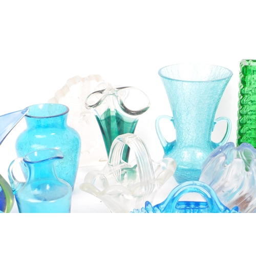 140 - A large collection of mid 20th century art glass. The collection to include a variety of examples in... 