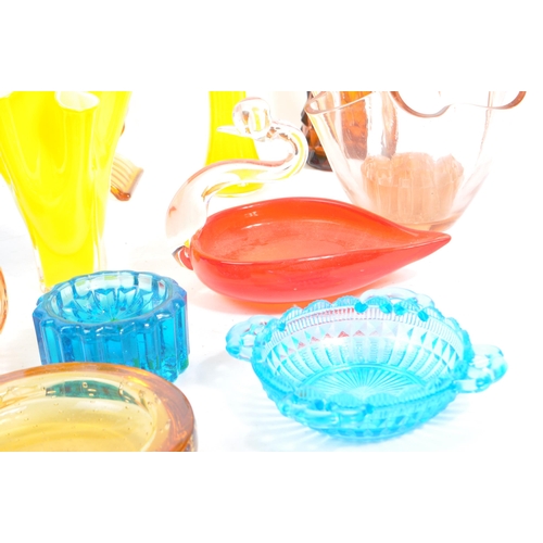 145 - A large collection of mid 20th century art glass. The collection to include a variety of glass dishe... 