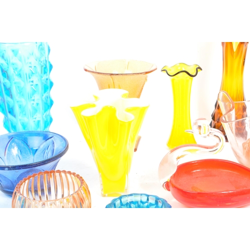 145 - A large collection of mid 20th century art glass. The collection to include a variety of glass dishe... 