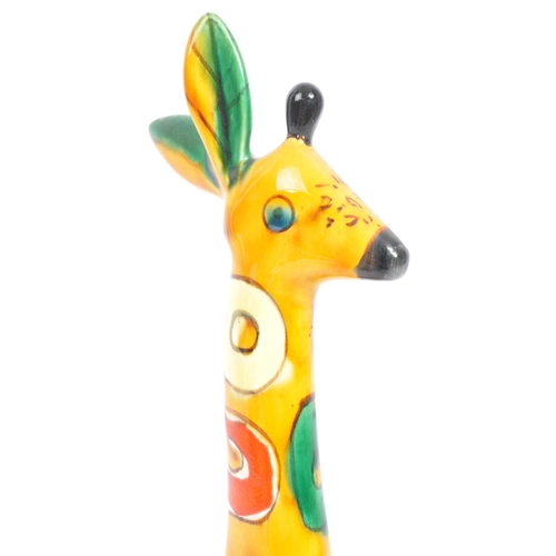 146 - A 1960s Lomonosov USSR ceramic figure / figurine of a giraffe. With multicoloured geometric patterns... 