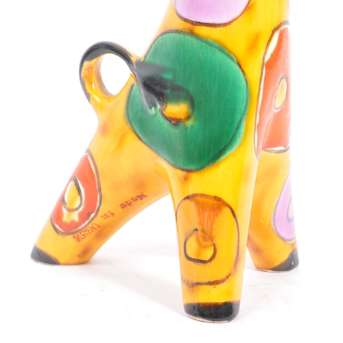 146 - A 1960s Lomonosov USSR ceramic figure / figurine of a giraffe. With multicoloured geometric patterns... 