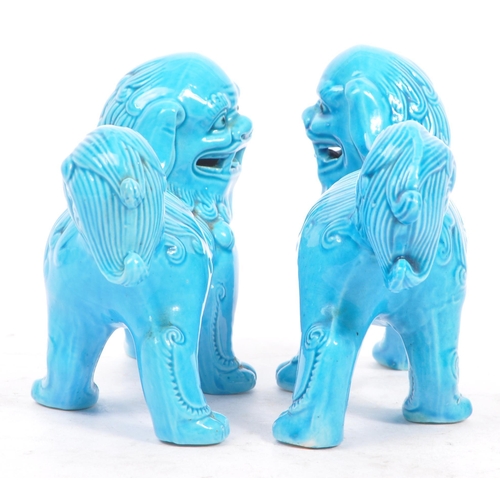 149 - A matching pair of Oriental 20th Century blue glazed ceramic Fu Dogs / Dogs of Foo figures sculpture... 