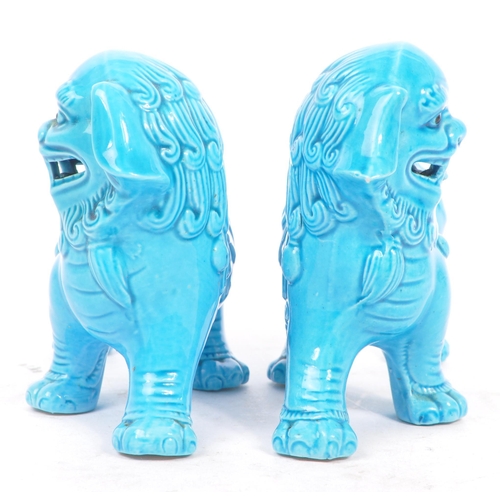 149 - A matching pair of Oriental 20th Century blue glazed ceramic Fu Dogs / Dogs of Foo figures sculpture... 