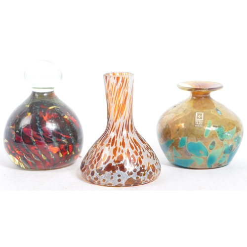 150 - An assortment of vintage studio art glass vases and paperweights. Comprising of two mdina squat bulb... 