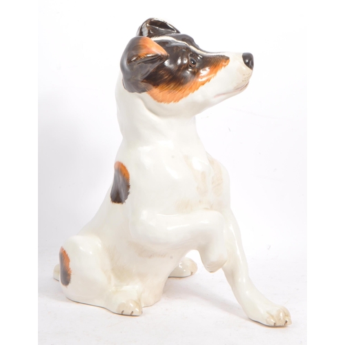 159 - Just Cats and friends - A vintage 20th century ceramic Jack Russel dog. In a seating position with p... 