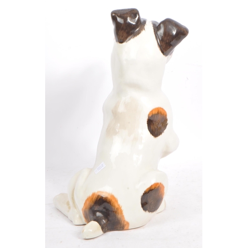 159 - Just Cats and friends - A vintage 20th century ceramic Jack Russel dog. In a seating position with p... 