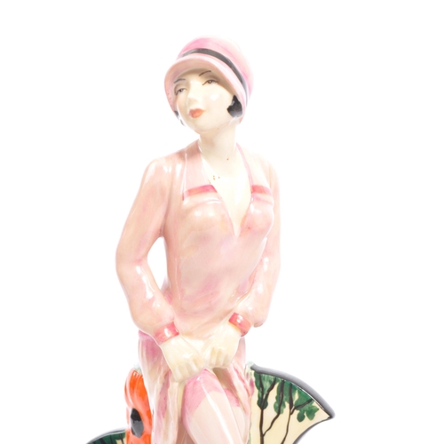 16 - A vintage late 20th century limited edition ceramic figurine of Clarice Cliff by Kevin Francis. The ... 