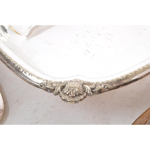 175 - A pair of 20th century silver plated Butler Sheffield entree lidded dishes. Each with a floral shape... 