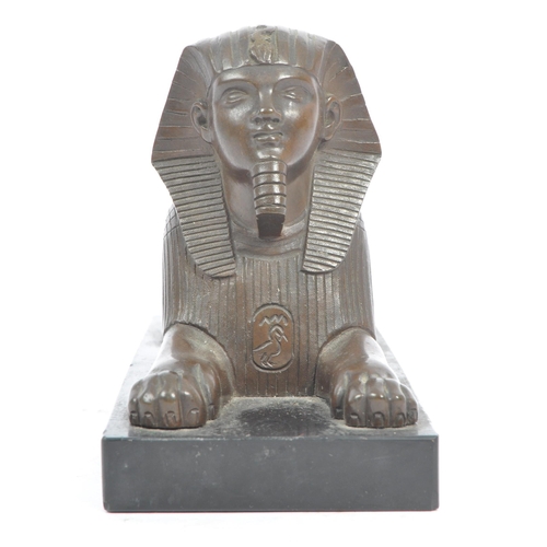 183 - An Egyptian Revival late Victorian early 20th century circa 1900 cast bronze figure of Sphinx. The f... 