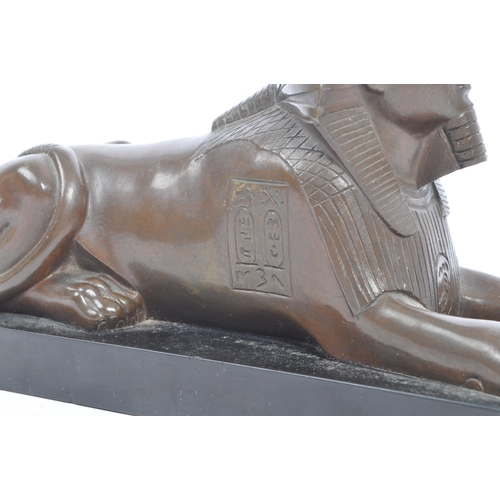 183 - An Egyptian Revival late Victorian early 20th century circa 1900 cast bronze figure of Sphinx. The f... 