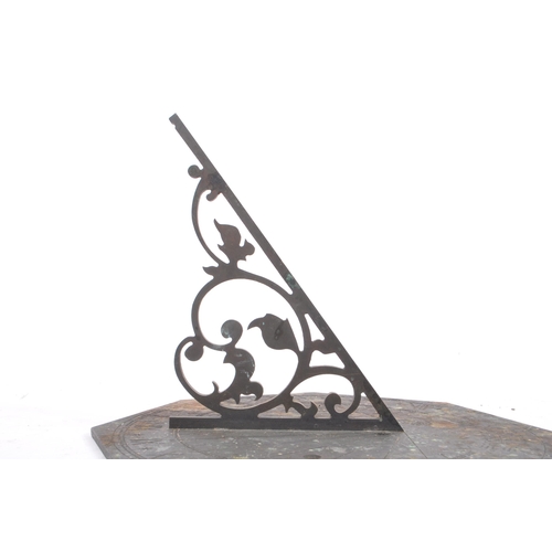 188 - A late 19th century / early 20th century bronze octagonal table desk sundial. The dial having a pier... 