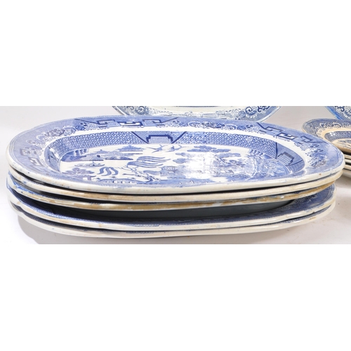 19 - A collection of 19th century stone china Staffordshire blue and white plates / platters. Having 9 pl... 