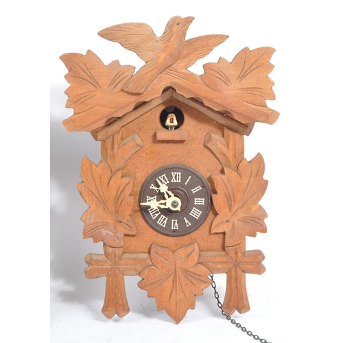 194 - Three mid 20th century carved wood cuckoo clocks, possibly of Black Forest German origin. The clocks... 