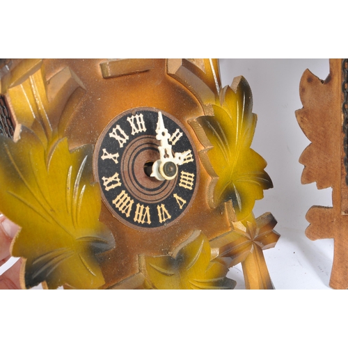 194 - Three mid 20th century carved wood cuckoo clocks, possibly of Black Forest German origin. The clocks... 