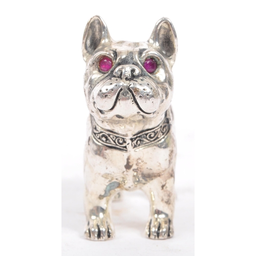 205 - A vintage mid 20th century French Bulldog pin cushion. In a standing position with purple material a... 