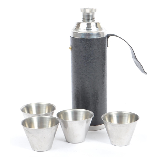 214 - A set of six 20th century silver plated graduating travel cups in leather case, alongside a stainles... 