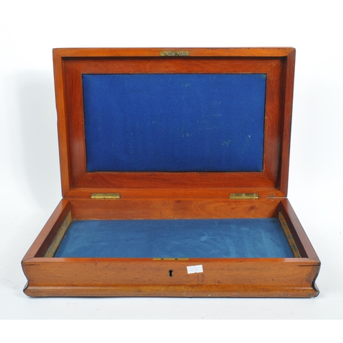 215 - A collection of three 20th century wooden trinket boxes. Each of the boxes having blue baize lining.... 