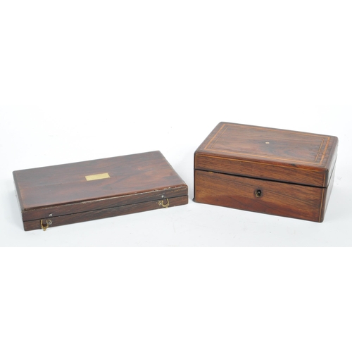 215 - A collection of three 20th century wooden trinket boxes. Each of the boxes having blue baize lining.... 