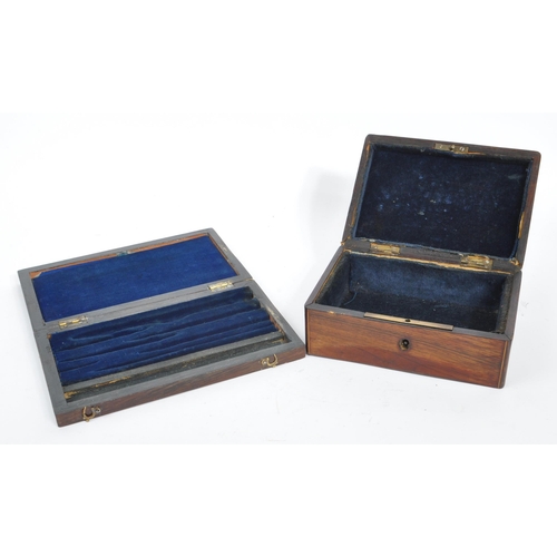 215 - A collection of three 20th century wooden trinket boxes. Each of the boxes having blue baize lining.... 