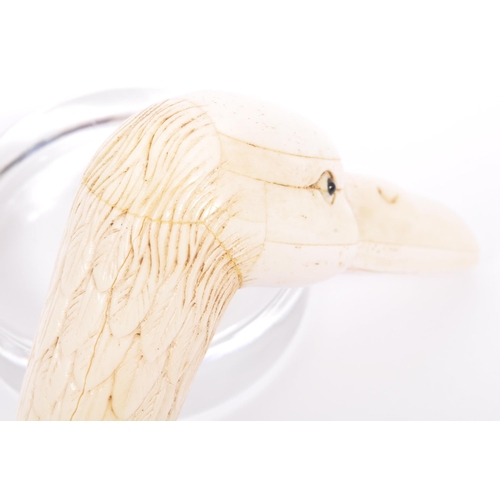 216 - A vintage 20th century walking stick / swagger cane handle. In the form of a duck of carved form and... 