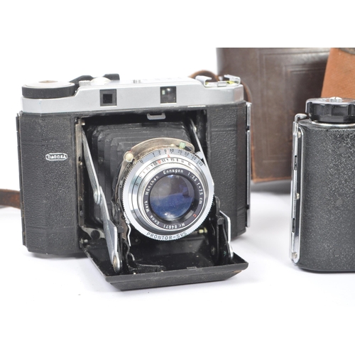 219 - A mid 20th century circa 1960s Minolta AF 35mm rangefinder camera alongside other 20th century camer... 