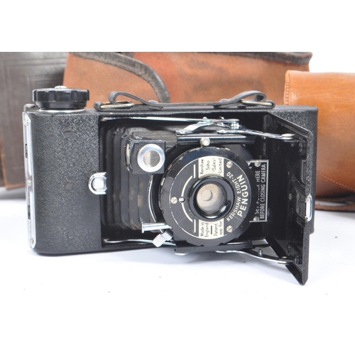 219 - A mid 20th century circa 1960s Minolta AF 35mm rangefinder camera alongside other 20th century camer... 