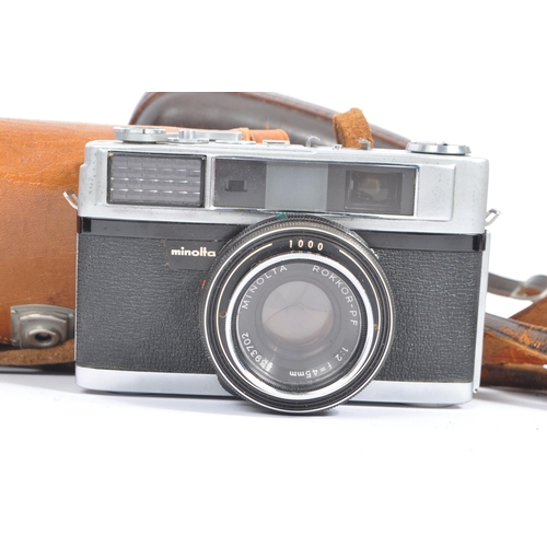 219 - A mid 20th century circa 1960s Minolta AF 35mm rangefinder camera alongside other 20th century camer... 